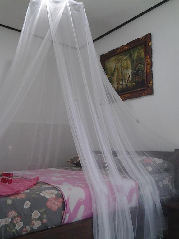 Tirta Yoga Inn Падангбай Номер фото